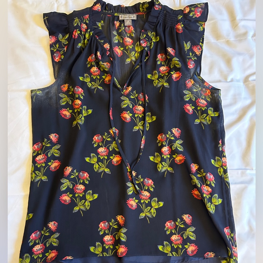 Navy blue and floral sleeveless blouse